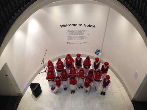 A Sikh children's choir in a gallery