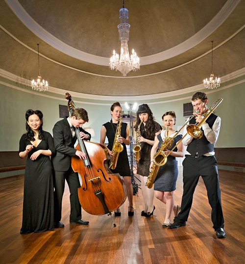 A group of musicians in a historic house